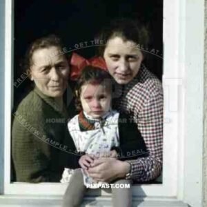 little girl with her mother and grandmother at the window, Germany 1937