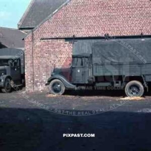 parked trucks at Wehrmacht quarter in Niederaußem, Germany 1940