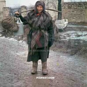 peasant woman in winter clothes and grave boots in Russia 1944
