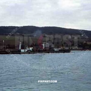 river paddle steamer on River Rhine, Rüdesheim, Hessen, 1939. Shell oil refinery.