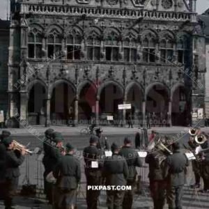 wehrmacht music band playing in front of the town hall of Saint Quentin, France 1940