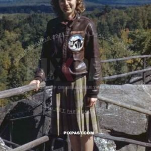 wife of a USAAF pilot wears proudly her mans Air Force jacket with Unit Patch. Dated USA 1942.