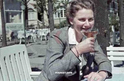 woman having a drink in Travemünde, Germany 1940