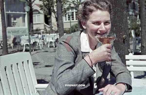 woman having a drink in Travemünde, Germany 1940
