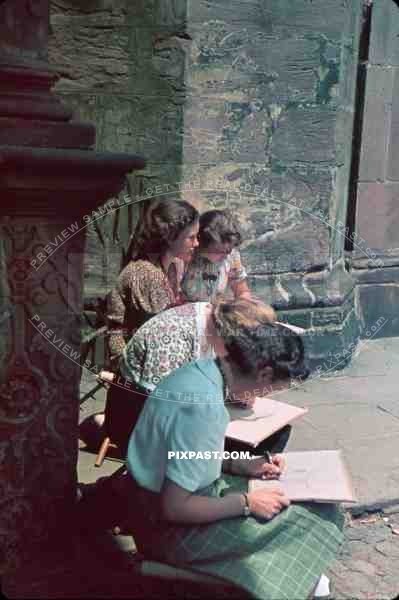 young girls drawing in the street in Freiburg, Germany 1939